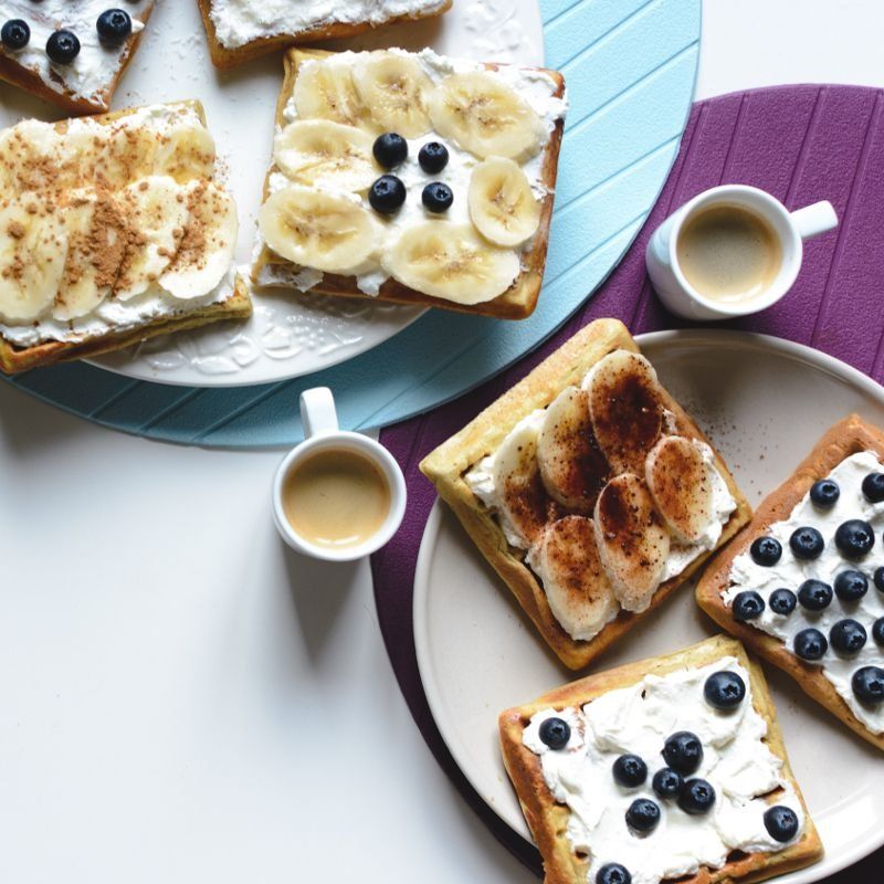 foodiesfeed.com banana and bluberries waffles with coffee espresso